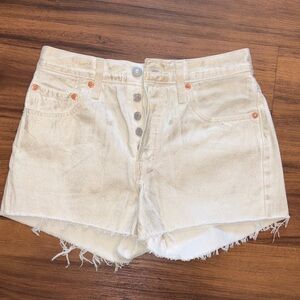 Unique white with gold shimmer Levi's 501 cut off shorts. Brand new!